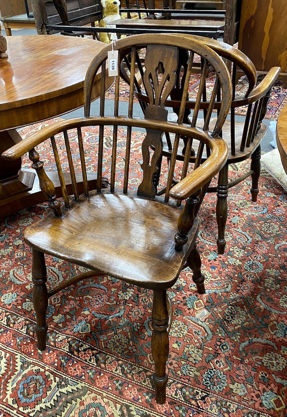 A near pair of 19th century Lincolnshire ash and elm Windsor elbow chairs, width 55cm, depth 38cm, height 91cm